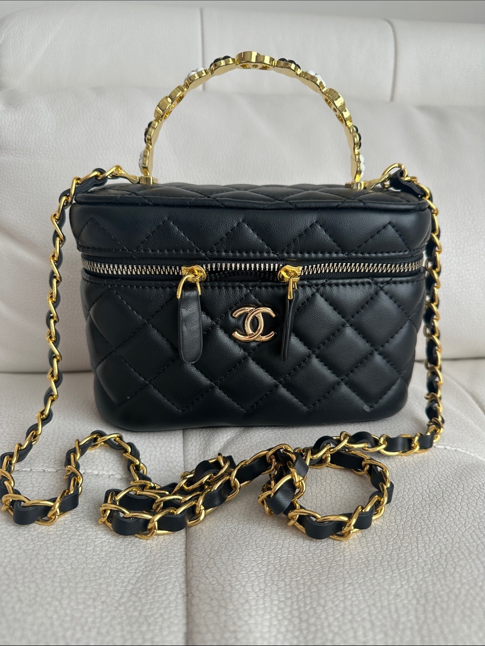Black Vaniity bag golden flower hardware with minor flaw last photo worn once